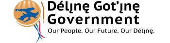 Logo of the Déline Got’ine Government with an emblem featuring a blue bird in flight on a golden circle, and red, white, and blue ribbon accents. The text reads, "Déline Got'ine Government - Our People. Our Future. Our Déline.