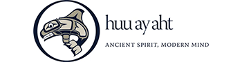 A logo featuring a stylized depiction of an orca on the left, with the text "huu ay aht" to the right. Below the text is the slogan "ANCIENT SPIRIT, MODERN MIND." The design incorporates a blend of traditional and contemporary elements.